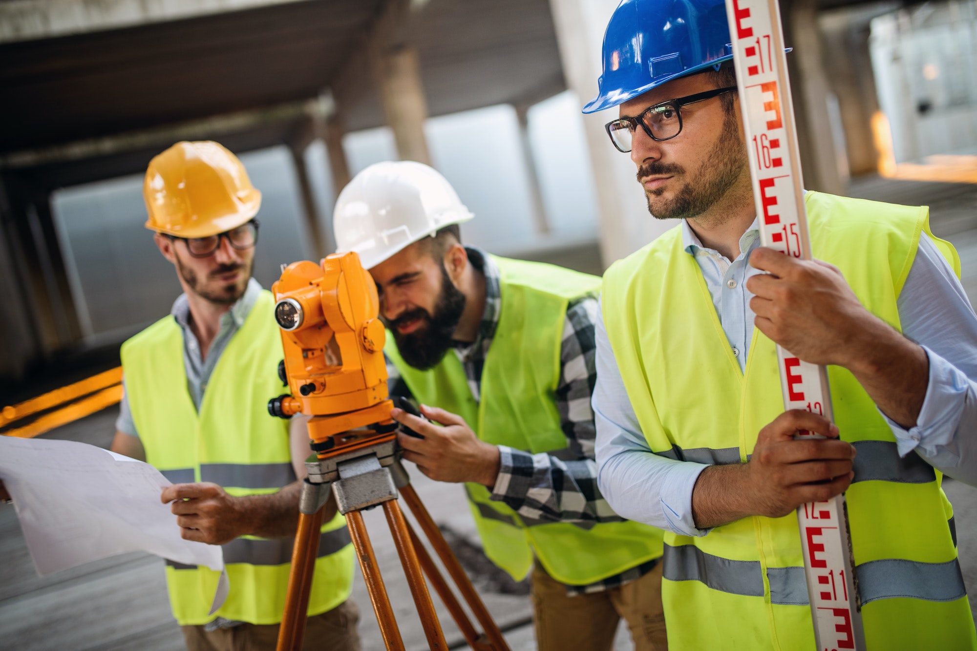 Construction engineers discussion with architects at construction or building site