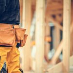 Residential Buildings Construction Worker with Tools Belt Close Up